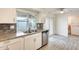 Close up of the sink and stainless steel dishwasher in a bright kitchen space at 10909 W Santa Fe Dr, Sun City, AZ 85351