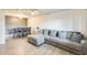 Spacious living and dining area with modern decor and wood-look tile flooring at 10909 W Santa Fe Dr, Sun City, AZ 85351