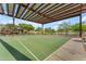 Community basketball court with solar shade and lush landscape at 10931 S Santa Columbia Dr, Goodyear, AZ 85338