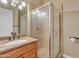 Bathroom featuring a glass shower enclosure and granite countertop vanity at 10931 S Santa Columbia Dr, Goodyear, AZ 85338