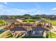 Aerial view of a community playground with canopied picnic areas at 10931 S Santa Columbia Dr, Goodyear, AZ 85338