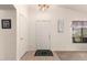 Welcoming entryway with neutral tones, a decorative rug, and natural light at 1297 E Maddison St, San Tan Valley, AZ 85140