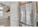 Kitchen with stainless steel refrigerator and an antler mount on the wall in the adjacent room at 1313 E Tyson St, Chandler, AZ 85225