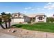 Charming single-story home with a well-maintained lawn and desert landscaping in a sunny neighborhood at 14108 W Circle Ridge Dr, Sun City West, AZ 85375