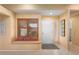 Bright foyer with a cozy window seat, tiled floor, and neutral colors at 14108 W Circle Ridge Dr, Sun City West, AZ 85375