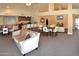 Spacious clubhouse features a kitchen, bar, lounge areas, and dining tables for community gatherings at 14145 N 92Nd St # 1031, Scottsdale, AZ 85260