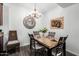 Charming dining area featuring a modern chandelier, decorative wall art, and comfortable seating at 14145 N 92Nd St # 1031, Scottsdale, AZ 85260