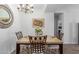 Bright dining room with stylish chandelier and comfortable seating, perfect for Gathering gatherings at 14145 N 92Nd St # 1031, Scottsdale, AZ 85260