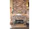 The cozy fireplace features a stone surround and a mantel perfect for displaying decorative items at 14145 N 92Nd St # 1031, Scottsdale, AZ 85260