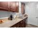 Beautiful kitchen with stainless steel sink, granite countertops, and abundant cabinet storage at 14145 N 92Nd St # 1031, Scottsdale, AZ 85260