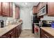 Efficient kitchen featuring stainless steel appliances, granite countertops, and ample cabinet space at 14145 N 92Nd St # 1031, Scottsdale, AZ 85260