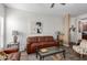 Inviting living room with a comfortable brown leather sofa and stylish glass-topped coffee table at 14145 N 92Nd St # 1031, Scottsdale, AZ 85260