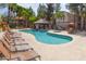 Resort-style pool area with plenty of lounge chairs, a gazebo, and lush landscaping at 14145 N 92Nd St # 1031, Scottsdale, AZ 85260