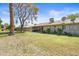 Lush backyard with a covered patio, adorned with decorative plants and landscaping, perfect for relaxation at 14633 N Boswell Blvd, Sun City, AZ 85351
