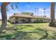 Expansive backyard with a covered patio and mature landscaping, creating a serene and private outdoor retreat at 14633 N Boswell Blvd, Sun City, AZ 85351