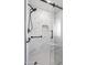 Walk-in shower features updated tile and grab bar at 14633 N Boswell Blvd, Sun City, AZ 85351