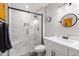 Bathroom with a modern vanity, a glass shower, and a round mirror at 14633 N Boswell Blvd, Sun City, AZ 85351