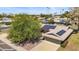 An aerial view of a well-maintained home with solar panels and lush greenery in a peaceful residential area at 14633 N Boswell Blvd, Sun City, AZ 85351