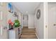 Hallway with wood floors, neutral walls, decorated with tasteful wall art and decor at 14633 N Boswell Blvd, Sun City, AZ 85351