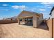 A backyard view shows a covered patio and a block wall at 14777 W Soft Wind Dr, Surprise, AZ 85387
