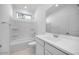 Bright bathroom with white fixtures and a combined shower and tub at 14777 W Soft Wind Dr, Surprise, AZ 85387