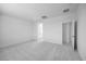 Spacious bedroom features neutral carpeting, white walls, and ample natural light at 14777 W Soft Wind Dr, Surprise, AZ 85387