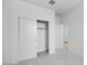 Bedroom with an open closet and white walls at 14777 W Soft Wind Dr, Surprise, AZ 85387