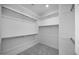 Organized walk-in closet with ample shelving and hanging space for optimal storage at 14777 W Soft Wind Dr, Surprise, AZ 85387