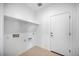 Simple laundry room with white walls and shelving at 14777 W Soft Wind Dr, Surprise, AZ 85387