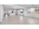 Bright and airy living room features tile floors and seamless transitions to the kitchen, creating an open and inviting space at 14777 W Soft Wind Dr, Surprise, AZ 85387