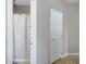 Bathroom featuring tiled floors, neutral paint, and a walk-in shower with a decorative curtain at 1589 E Manor Dr, Casa Grande, AZ 85122