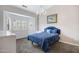 Cozy bedroom featuring plush carpeting, chandelier, and a comfortable-looking bed with matching décor at 1589 E Manor Dr, Casa Grande, AZ 85122