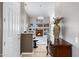 Open entryway leads to the living area featuring stylish décor, tile floors, and a cozy fireplace at 1589 E Manor Dr, Casa Grande, AZ 85122