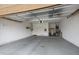 Spacious garage with a concrete floor, white walls, and ample storage and utility systems at 1589 E Manor Dr, Casa Grande, AZ 85122