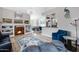 Bright living room with fireplace, elegant chandelier, adjacent dining area, and comfortable seating at 1589 E Manor Dr, Casa Grande, AZ 85122