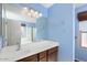 Well-lit bathroom with a large vanity and plenty of lighting at 15911 W Carmen Dr, Surprise, AZ 85374