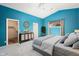 Brightly colored bedroom with walk-in closet, ensuite bathroom, and ceiling fan at 15911 W Carmen Dr, Surprise, AZ 85374