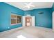 Bedroom featuring a ceiling fan, window with blinds and an open doorway at 15911 W Carmen Dr, Surprise, AZ 85374
