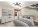 Cozy bedroom featuring a unique wall design, modern furniture, and window at 15911 W Carmen Dr, Surprise, AZ 85374