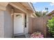 Inviting front door with a welcome mat and desert-friendly landscaping at 15911 W Carmen Dr, Surprise, AZ 85374
