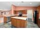 Kitchen featuring an island, stainless appliances, plenty of cabinets and countertop space at 15911 W Carmen Dr, Surprise, AZ 85374