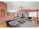 Inviting living room with a ceiling fan, stylish furniture, and an open layout at 15911 W Carmen Dr, Surprise, AZ 85374