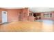 Open concept living room with hardwood floors adjacent to the kitchen and dining areas at 15911 W Carmen Dr, Surprise, AZ 85374