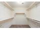 Spacious walk-in closet with built-in shelving and plenty of room for storage at 15911 W Carmen Dr, Surprise, AZ 85374