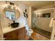 Modern bathroom featuring a stylish sink, a large mirror, and a luxurious walk-in shower at 16545 E Gunsight Dr # 103, Fountain Hills, AZ 85268