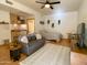 Comfortable living space offering a cozy gray couch, stylish rug, and efficient kitchenette at 16545 E Gunsight Dr # 103, Fountain Hills, AZ 85268