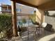 Inviting patio with comfortable seating, overlooks a lush pool area at 16545 E Gunsight Dr # 103, Fountain Hills, AZ 85268