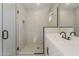Bathroom with modern vanity, matte black hardware, a glass-enclosed shower with tiled walls and tiled floors at 2121 W Sonoran Desert Dr # 45, Phoenix, AZ 85085