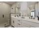 Modern bathroom featuring double sink vanity, black hardware, large mirror and glass enclosed shower at 2121 W Sonoran Desert Dr # 45, Phoenix, AZ 85085