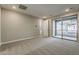 Neutral bedroom featuring plush carpeting and sliding glass doors to a private balcony at 2121 W Sonoran Desert Dr # 45, Phoenix, AZ 85085